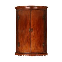 A GEORGE III HANGING CORNER CABINET