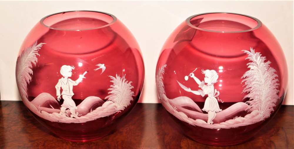 Mary Gregory Cranberry glass bowls.