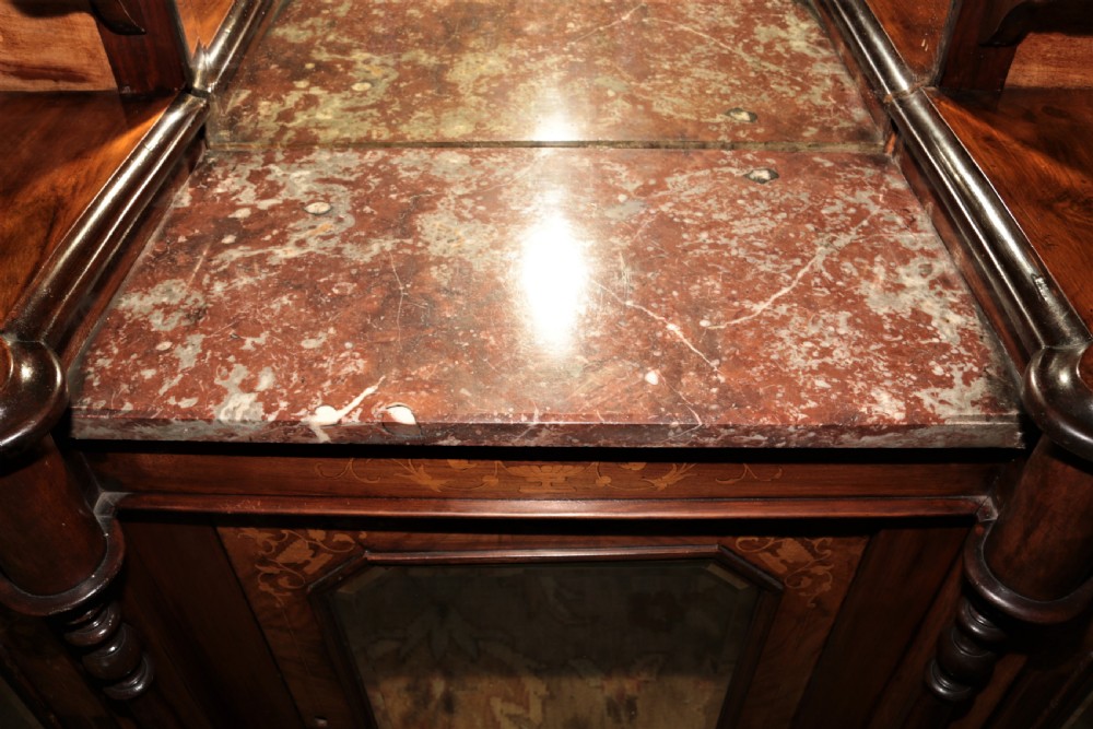 An ornate Victorian walnut chiffonier featuring a central arched mirror topped with a carved eagle crest, flanked by raised side shelves with oval mirror panels and cupboard doors below. View IV