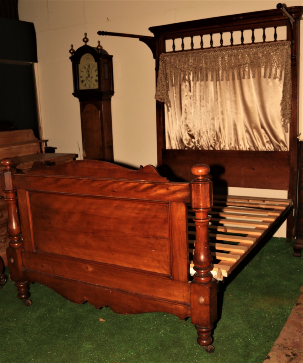 Victorian half tester type bed.