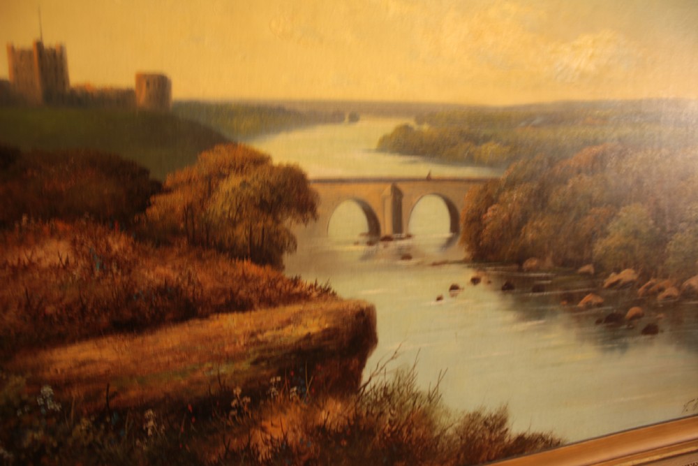 A framed landscape oil painting on canvas depicting Richmond Castle, a stone river bridge, and dense foliage beneath a soft blue sky. View VII