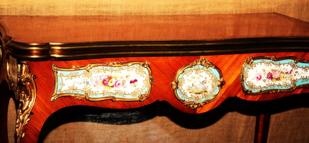 A mid-Victorian kingwood games table featuring cabriole legs, ornate gilt-bronze ormolu mounts, and inlaid porcelain plaques depicting floral scenes. View III