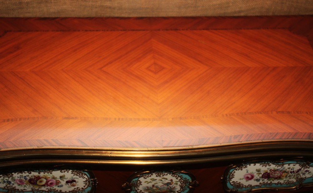 A mid-Victorian kingwood games table featuring cabriole legs, ornate gilt-bronze ormolu mounts, and inlaid porcelain plaques depicting floral scenes. View XIII