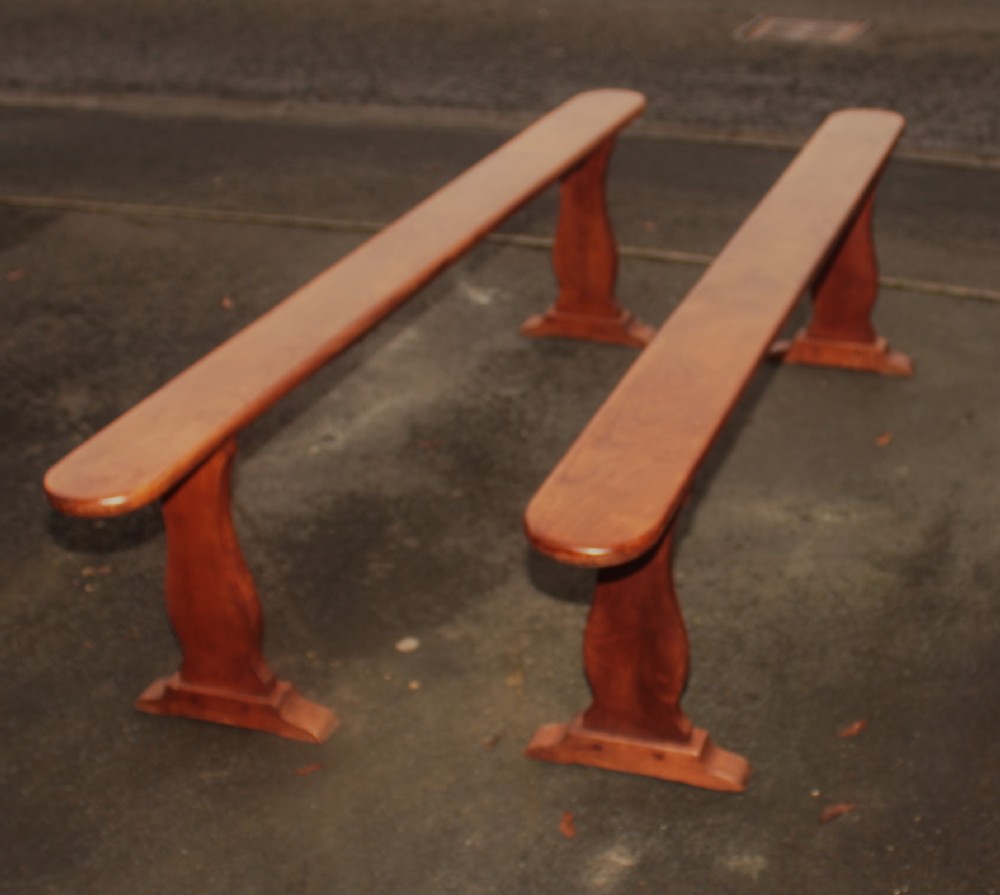 A pair fruit wood benches.