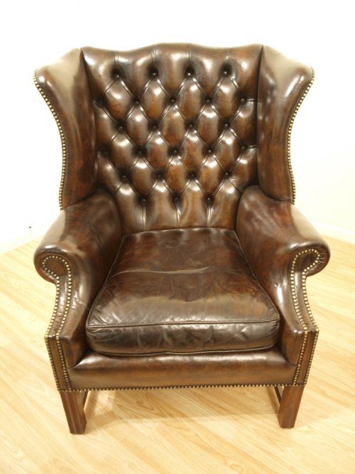 fig 1. A Pair Of Brown Leather George III Style Wing Armchairs