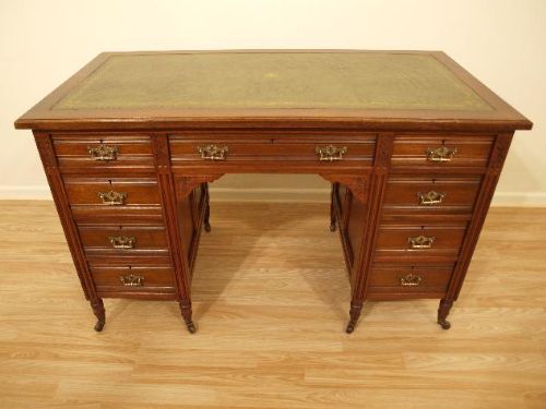 A Walnut Late Victorian Pedestal Desk by Edwards & Roberts