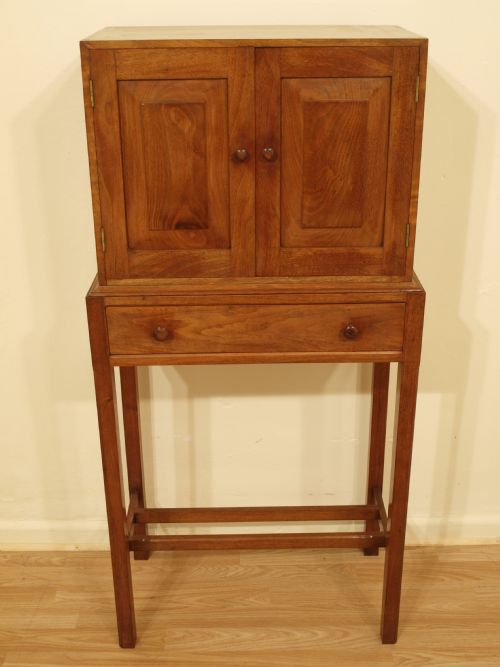 A Walnut Cotswold School Cabinet on Stand
