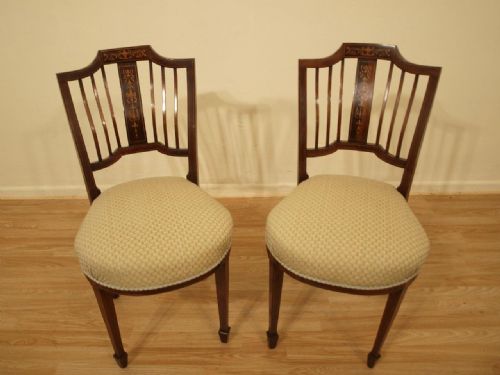 A Pair of Mahogany Inlaid Edwardian Chairs