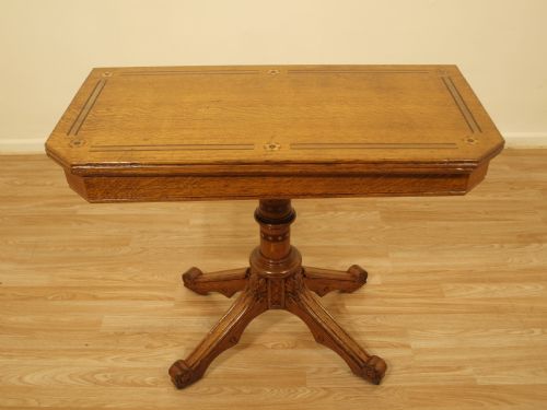 An Oak Aesthetic Period Antique Fold Over Card Table