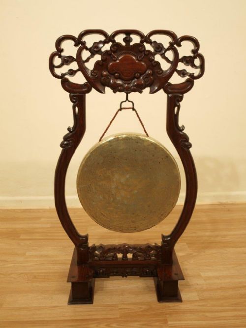 A Chinese Hardwood and Brass Gong
