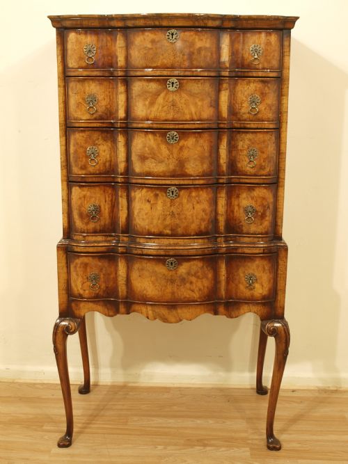 A Walnut George I Style Serpentine Chest on Stand