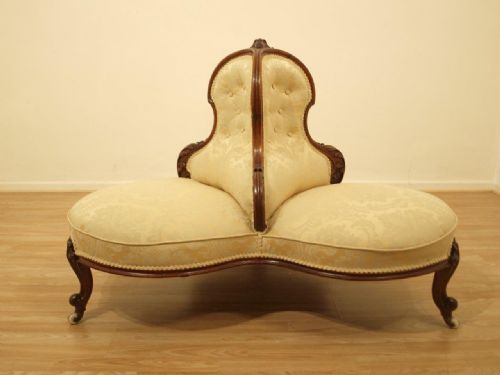 A Beautiful Walnut Victorian Period "Conversation" Settee