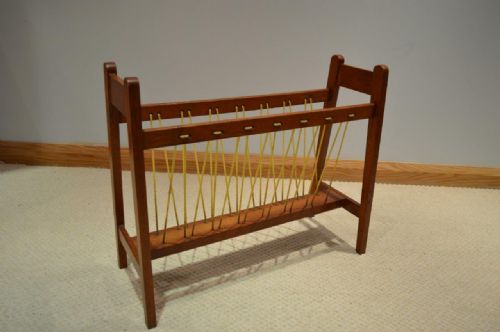 An Oak Arts & Crafts Period Magazine Rack by Arthur Simpson of Kendal