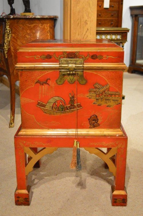 A Red Lacquer Chinoiserie Cellaret on Stand