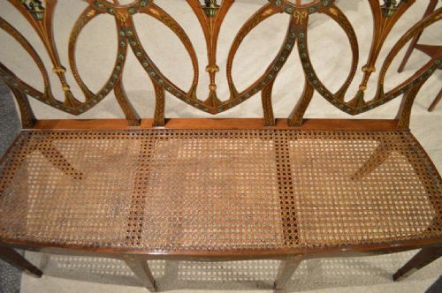 fig 1. A Sheraton Revival Edwardian Period triple shield back painted satinwood settee.