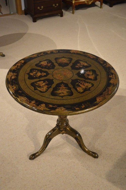 A Chinese Chinoiserie Circular Lacquered Tripod Table