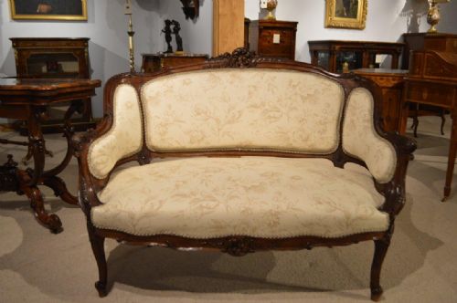 A Finely Carved French Walnut Settee/canapé