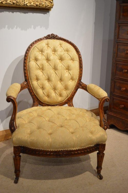 A Walnut Victorian Period Deep Buttoned Open Armchair