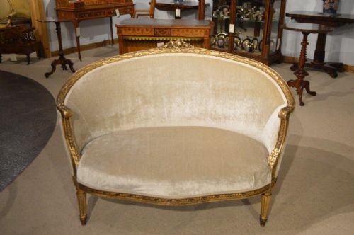 A Louis Xvi Style French Carved Gilt-wood Sofa