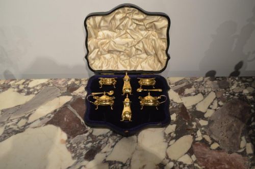 A Silver Gilt Edwardian Period Six Piece Condiment Set