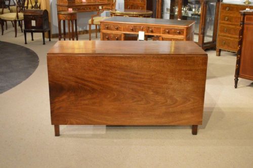 A Cuban Mahogany George III Period Drop Leaf Dining Table