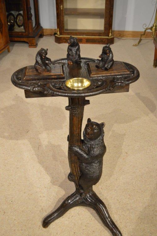 A Charming Black Forest Carved Smokers Table