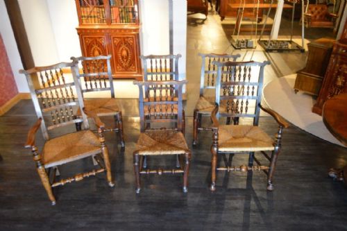 A Harlequin Set of 6 Ash and Elm Lancashire Spindle-back Dining Chairs Including Two Carver Armchairs.