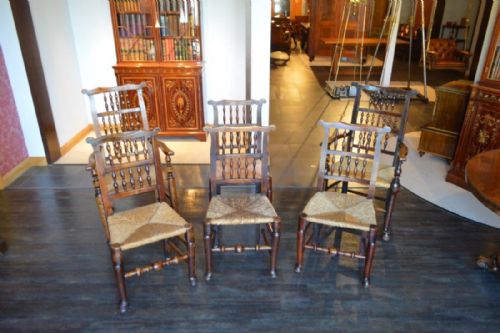 fig 1. A Harlequin set of 6 ash and elm Lancashire spindle-back dining chairs including two carver armchairs.