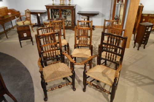 A Harlequin Set of 8  Lancashire Ash and Elm Spindle-back Chairs
