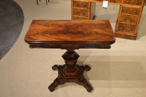 A Flamed Mahogany Early Victorian Period Fold Over Tea Table.