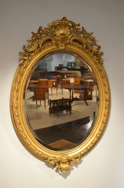 A French Late 19th Century Carved Gilt-wood Oval Mirror