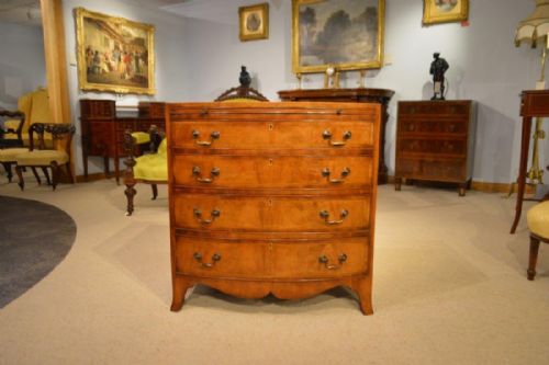 A Beautiful Edwardian Period Mahogany Bow Front Chest of Drawers with Brushing Slide