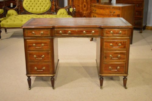 A Mahogany and Brass Mounted Late Victorian Period Pedestal Desk by Bertram & Sons, Oxford Street, London.