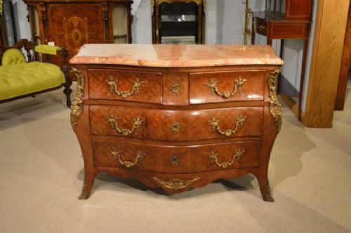 A Late19th Century French Serpentine Kingwood Parqeutry Commode/chest.