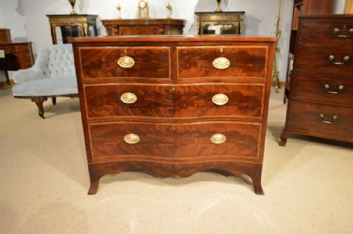A Beautiful Flame Mahogany Edwardian Period Serpentine Chest of Drawers.