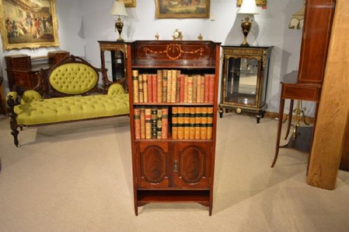 A Small Mahogany Inlaid Edwardian Period Mahogany Bookcase by Shapland & Petter of Barnstaple.
