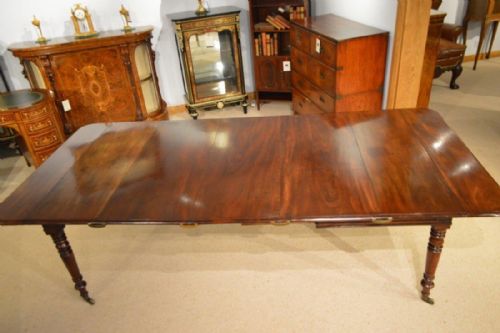 A Cuban Mahogany Regency Period Extending Dining Table