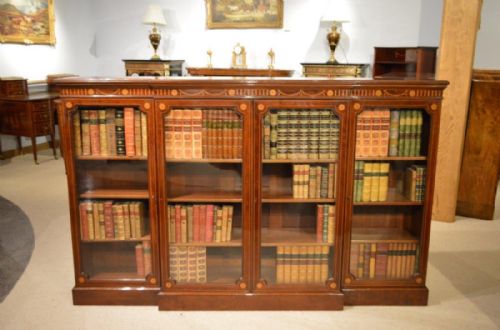 A Beautiful  Fiddleback Mahogany Late Victorian Period Sheraton Revival Breakfront Bookcase.