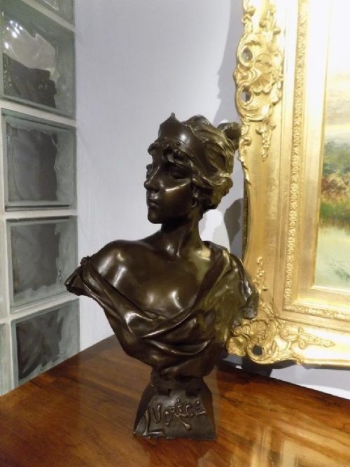 A Bronzed Art Nouveau Resin Figure of a Maiden After Villanis
