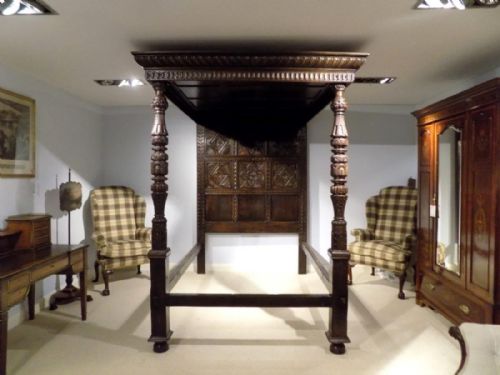 A Magnificent Oak Elizabethan Revival Four Poster Kingsize Bed
