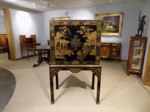 A Chinoiserie Gold Lacquered Cocktail Cabinet on Stand