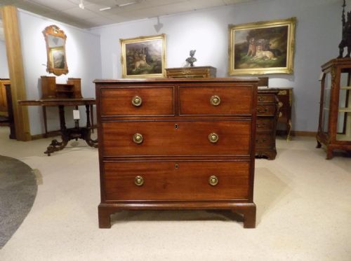 A Small Mahogany and Oak Regency Period Antique Chest of Drawers.