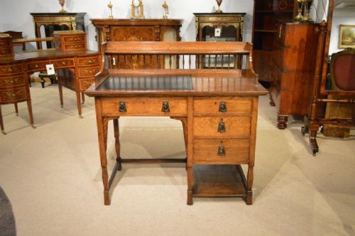 An Oak Arts & Crafts Period Writing Desk by Shapland & Petter of Barnstaple.
