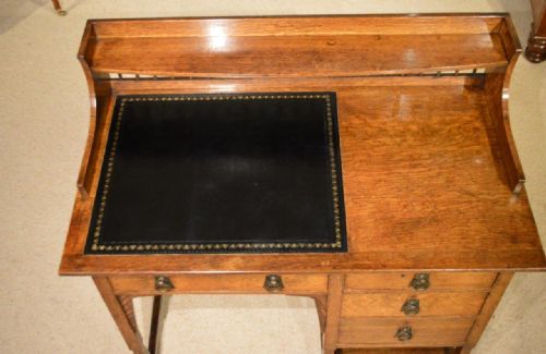 fig 1. An oak arts & crafts period writing desk by Shapland & Petter of Barnstaple.