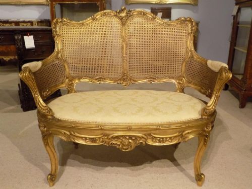 A Late 19th Century French Carved Gilt Wood and Bergere Canapé