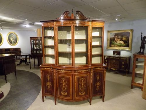 An Exhibition Quality Serpentine Mahogany Display Cabinet by Edwards & Roberts of London