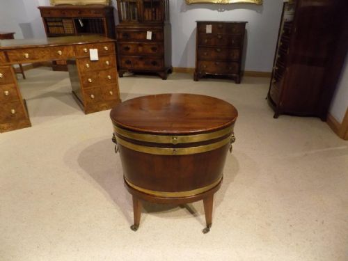 A George III Period Cuban Mahogany Oval Lead Lined Wine Cooler.