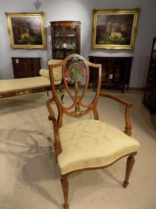 An Edwardian Period Sheraton Revival Satinwood Painted Armchair.