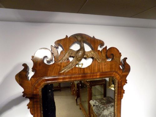 fig 1. A Chippendale Style George III Period mahogany pierced fretwork mirror.