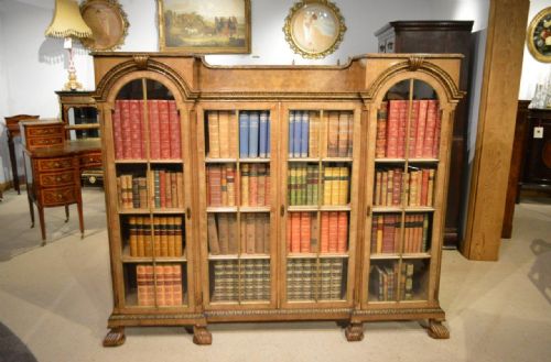 A Walnut, Parcel Gilt and Herring Bone Banded Queen Anne Revival Antique Bookcase.